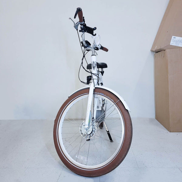 Alt text 1: A white Electra Townie Go motorized e-bike with a comfortable seat and ergonomic design, suitable for leisure and commuting.