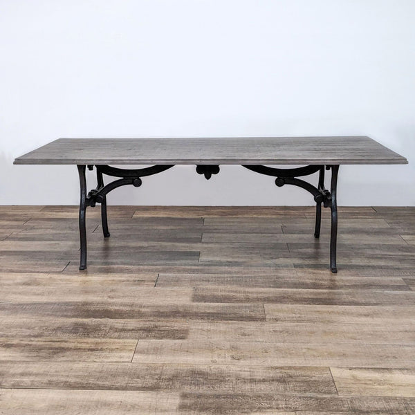 Alt text 1: Reperch dining table with a distressed natural finish fir tabletop and intricate black trestle base.