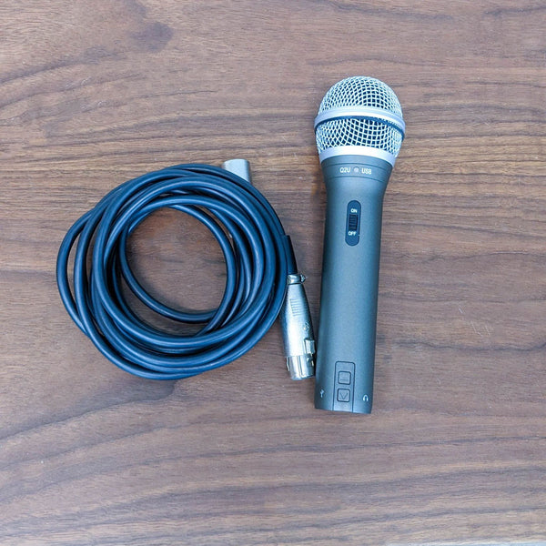 1. Samson Q2U dynamic microphone with XLR connector and USB port, presented with a coiled cable on a wooden surface for podcasting and recording.