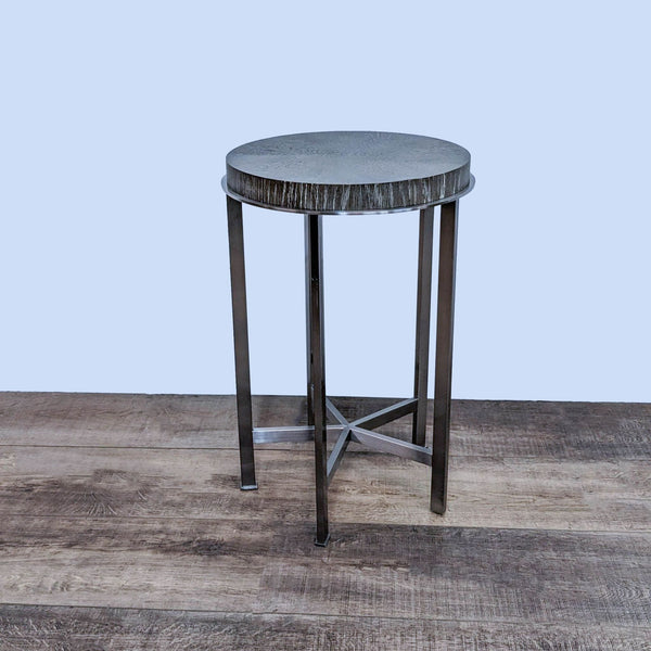 Alt text 1: Circular wooden top side table with a star-patterned finish, supported by a durable metal frame from Bassett Furniture.