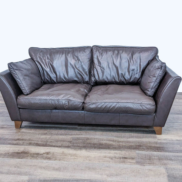 Marks & Spencer 3-seat compact leather sofa with flared arms and medium wood finish feet, front view.