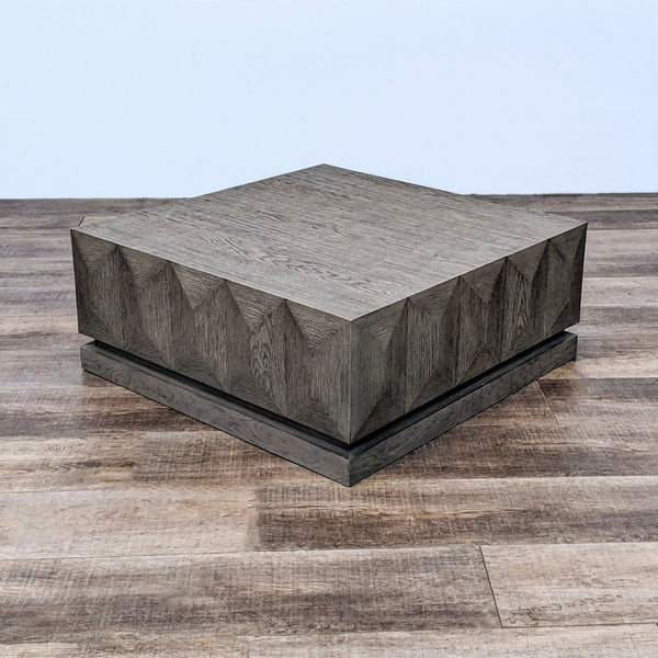 Reperch brand coffee table with a block style and gray stained finish on wooden floor.