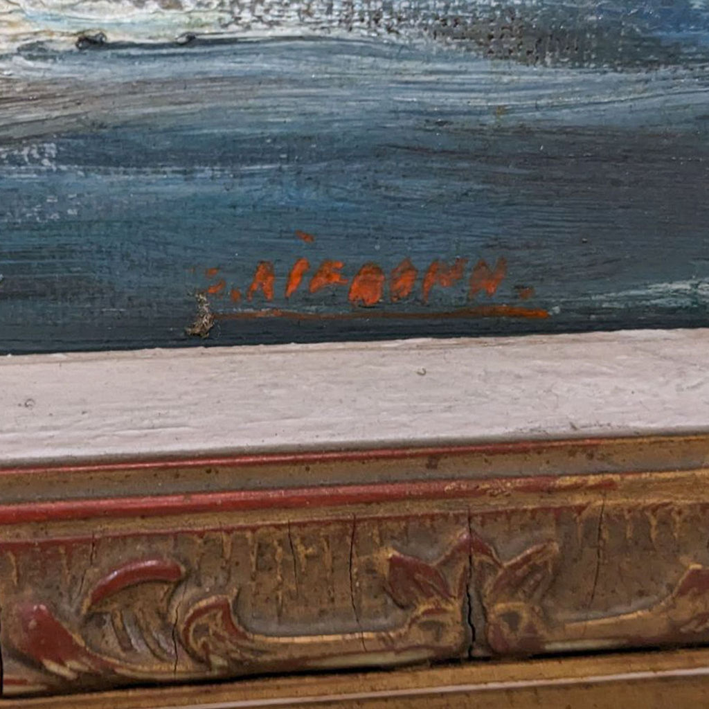 2. Close-up of artist's signature in red on a vintage beach landscape oil painting, with detailed texture visible on frame.