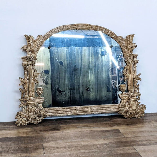Antique Reperch large mirror with detailed, carved wooden frame and segmented mirror panes.