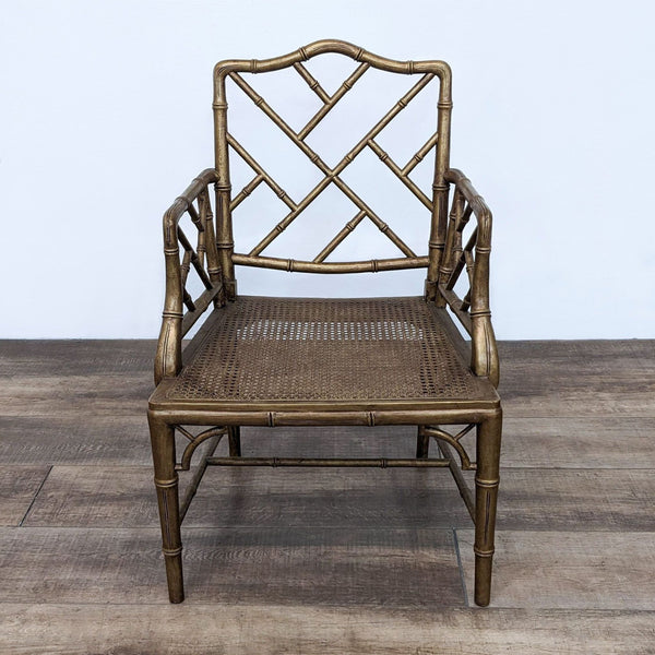 Bamboo-style dining chair by Reperch with faux bamboo frame and a woven rattan seat on a wooden floor.