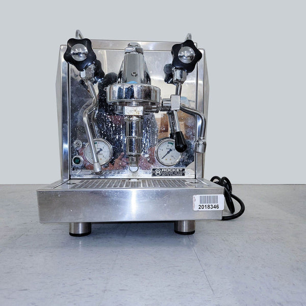 Rocket Espresso machine with stainless steel body, pressure gauge, and manual control levers for home baristas.