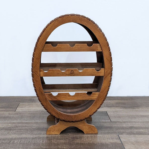 Alt text 1: Wooden barrel-shaped wine rack with 10 slots, standing on a flat base on a wooden floor.