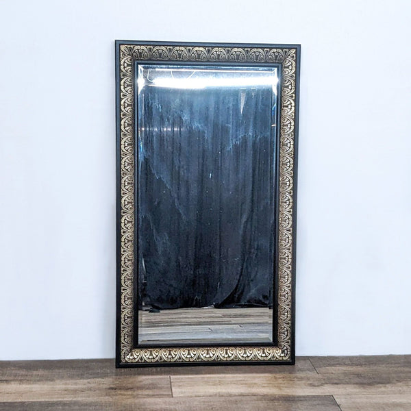 1. World Market antique brass-finished rectangle mirror with carved detailing on a dark frame, displayed against a white wall and wooden floor.
