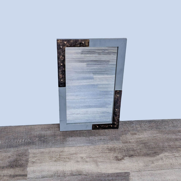 1. Reperch brand distressed metal frame mirror with rivet details, exhibiting an industrial, rustic design on a wooden floor.