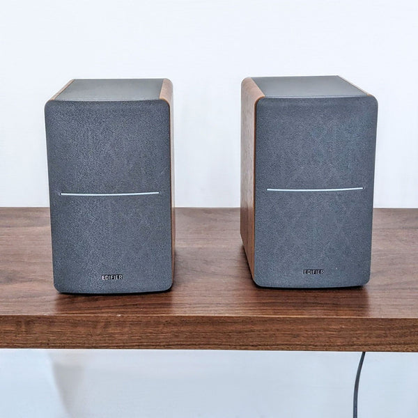 Edifier bookshelf speakers with wood-finish accents and Bluetooth connectivity for audio streaming.