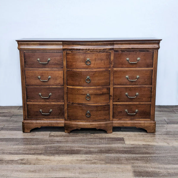 Reperch-brand traditional dresser with 12 drawers and curved front on a wooden floor.