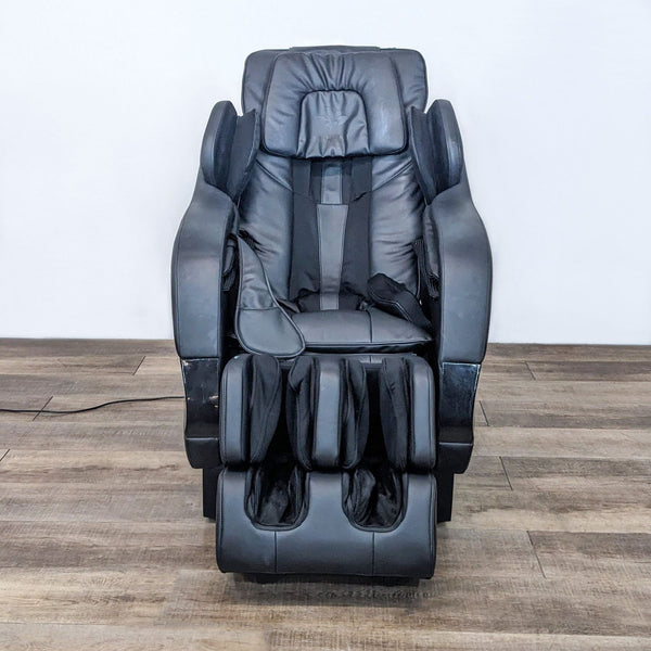 Kahuna SM-7300 massage chair with leg extension, zero gravity position option, and hardwood floor background.