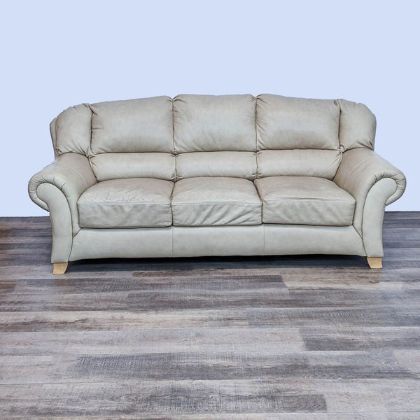 Alt text 1: Tan leather Reperch 3-seat sofa with high back lumbar support and curved arms on a wooden floor.