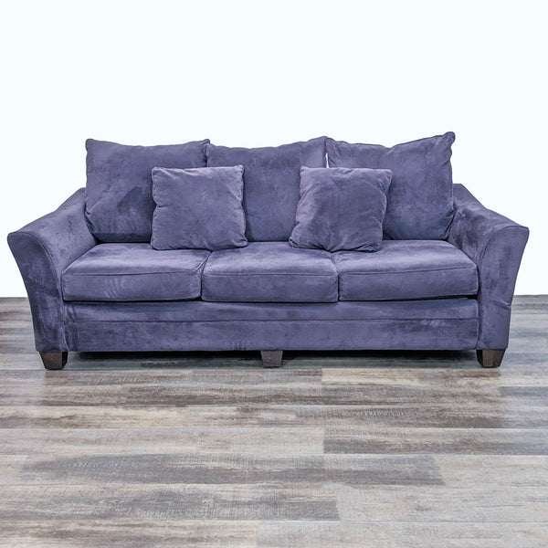 Reperch 3-seat contemporary curved arm sofa with dark wood feet, three cushions, and two pillows.