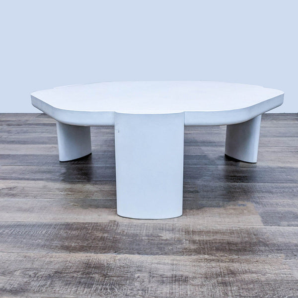 Pro-Living Asia modern white coffee table with a curved design on a wooden floor.