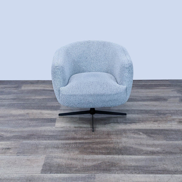 Contemporary Target lounge chair with textured light grey fabric and smooth swivel base on wooden flooring.