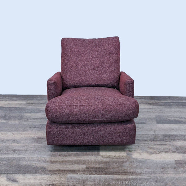 Room & Board linen-upholstered lounge chair with a glider on a swivel base, in a burgundy color, front view.