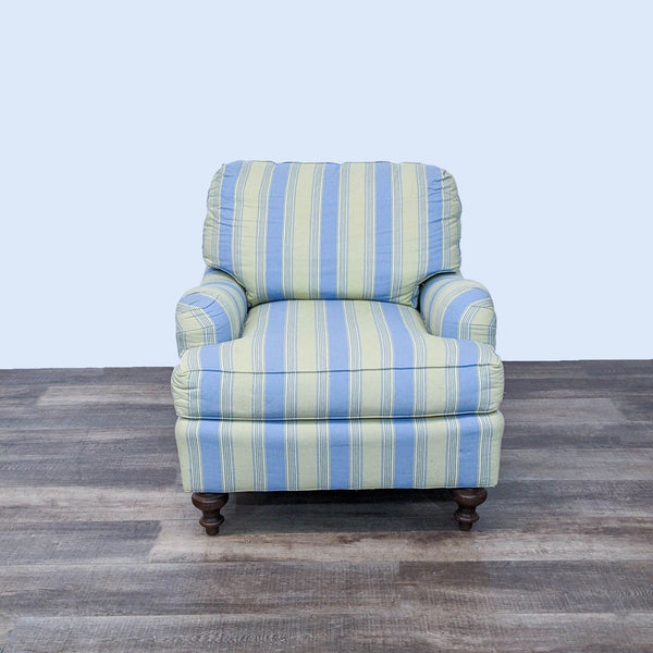 Alt text 1: Taylor King upholstered lounge chair with blue and neutral stripes, plush cushions, and wooden legs from the Kings Road Collection.