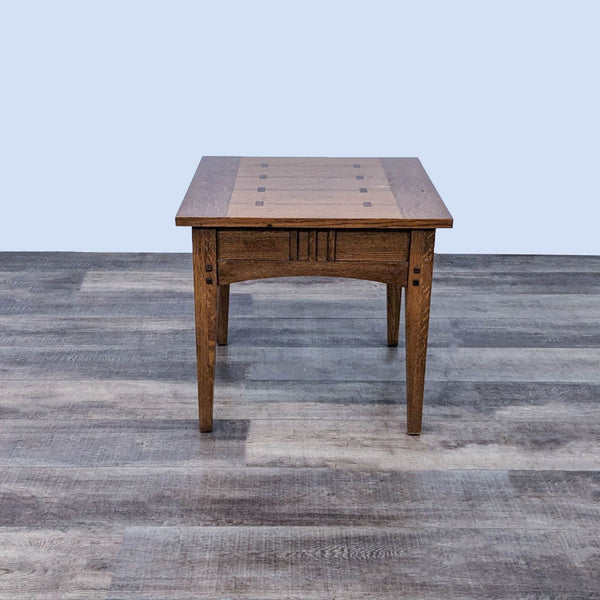 Reperch brand oak end table with a decorative inlay on top, placed on a wooden floor.