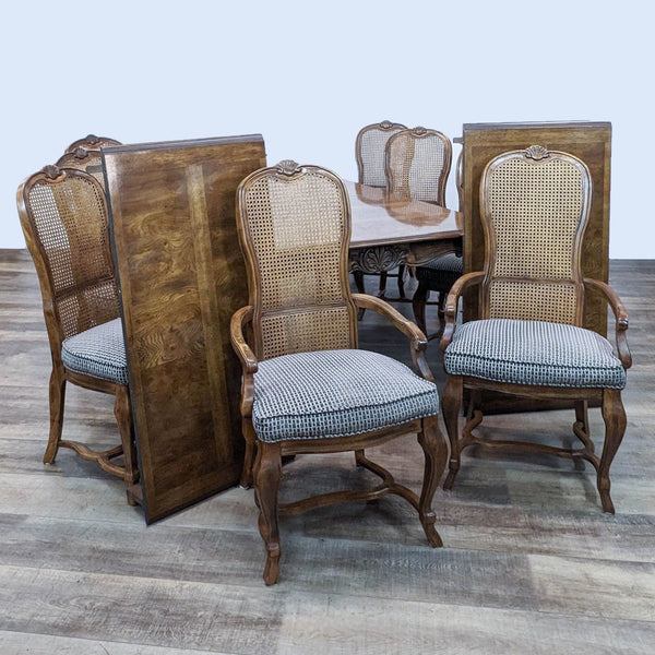 Drexel Heritage Dining Set with cane back chairs and patterned fabric seats, elegant wood table with carved trim.