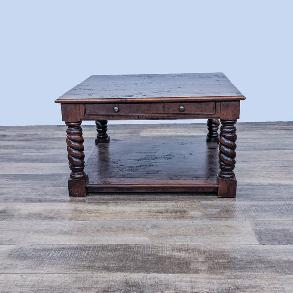 Reperch brand coffee table with barley twist legs and closed drawer, on wooden floor.