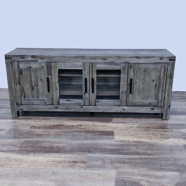 Alt text 1: Distressed taupe wire-brushed entertainment center with gray undertones, notched corners, and solid legs by Macy's Furniture Gallery.