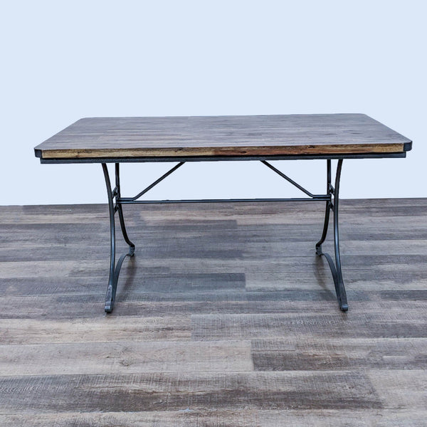 Jackson dining table with metal frame and wooden top by Cost Plus World Market, showcasing industrial style.