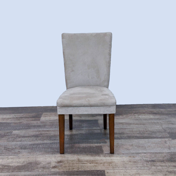 Reperch Parsons dining chair with light gray faux suede and wooden legs, front view on wooden floor.