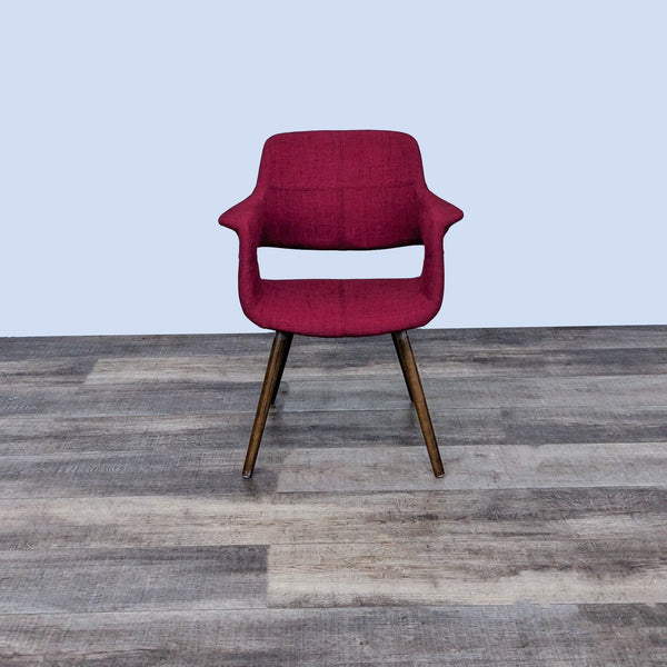 Alt text 1: A LumiSource Vintage Flair Chair in a burgundy fabric with angled wooden legs on a wood-patterned floor, showcasing a blend of retro and modern styles.