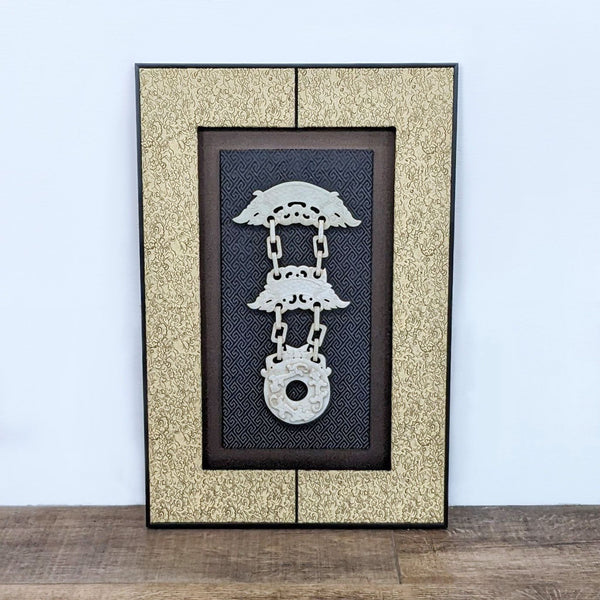 Elegant Reperch wall hanging with white jade carving and textured patterned background in an ornate frame.