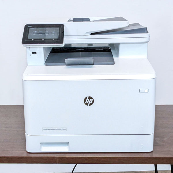 HP Color LaserJet Pro MFP with touchscreen interface, for printing, scanning, and copying.