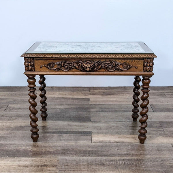 1. A Reperch oak table with intricate carvings and barley twist legs, featuring a fabric insert and glass top.