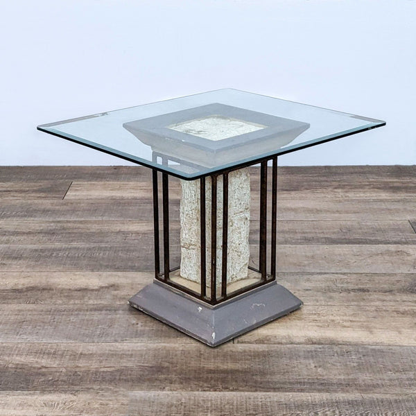 Reperch branded end table with a beveled glass top and a metal-framed pedestal on a wooden floor.