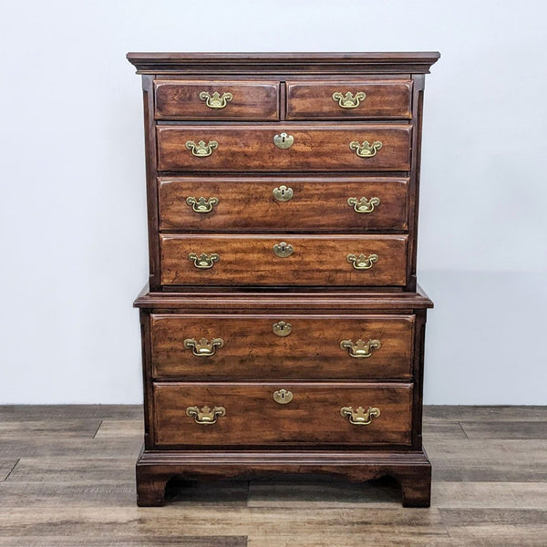Reperch classic highboy wooden dresser with six drawers and brass pulls, against a white background.