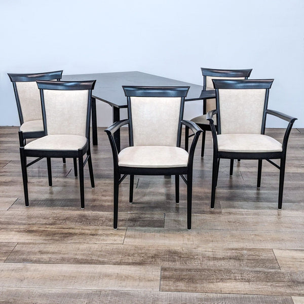 Reperch dining set with granite top table and five chairs, including two armchairs, with black frames and beige upholstery.