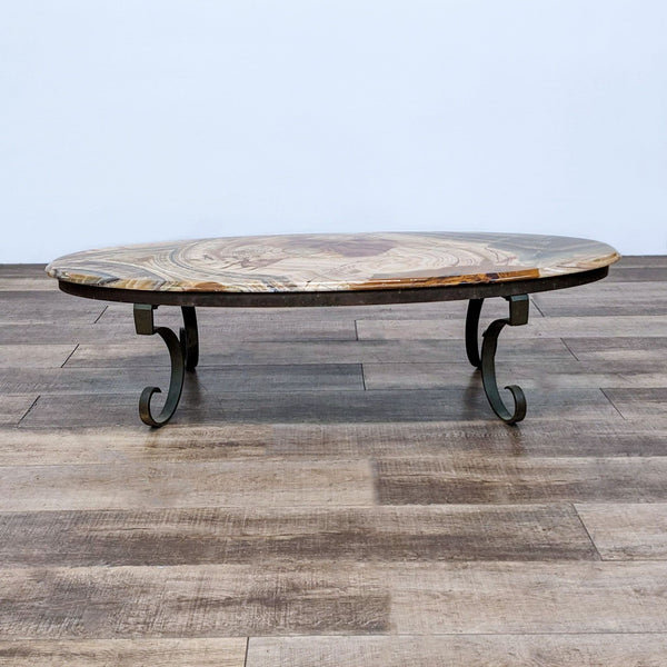 Reperch brand coffee table with wrought iron base and unique stone top, made in Mexico, from the side angle.