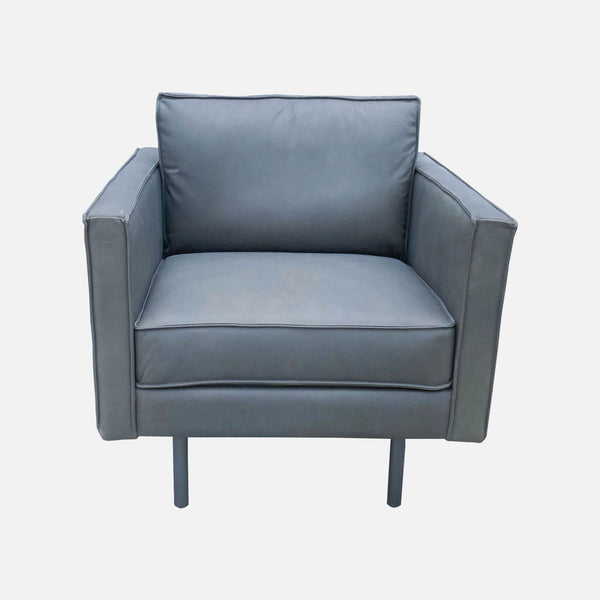 West Elm Axel lounge chair with sleek design and metal legs, upholstered in gray top grain leather.