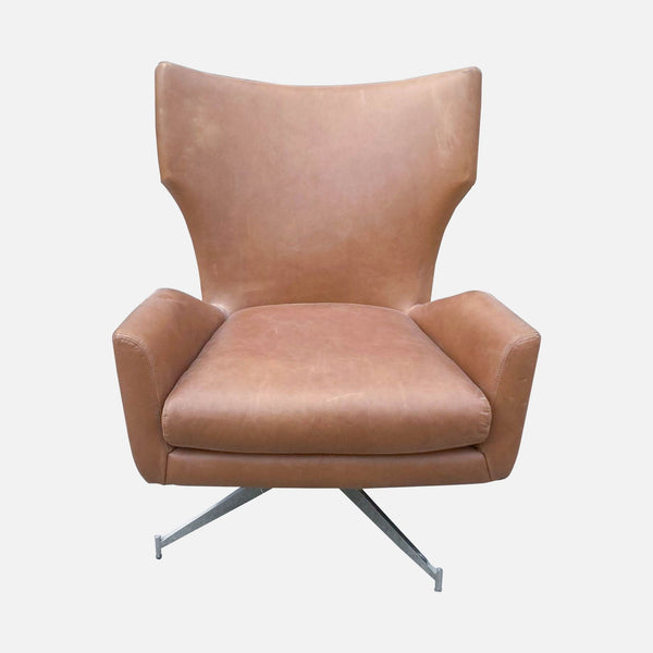 1. West Elm Hemming Swivel Armchair: High-backed, winged, leather upholstered chair with a deep seat on a metal swivel base.