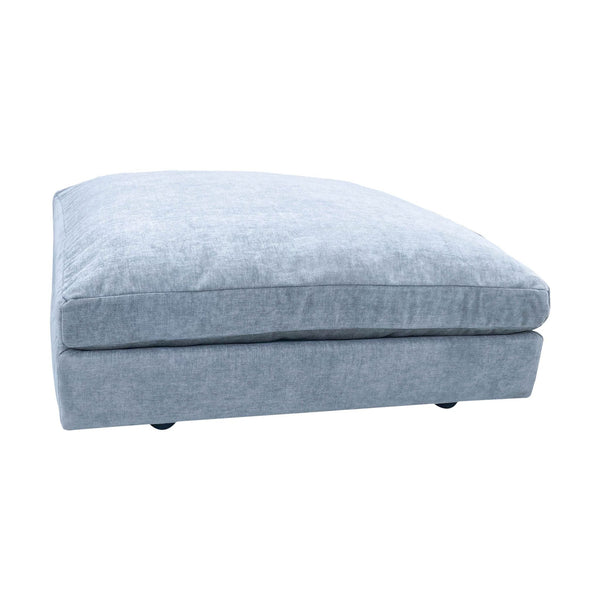1. West Elm distressed velvet ottoman in mineral gray, angled view, showcasing plush top and rounded corners.