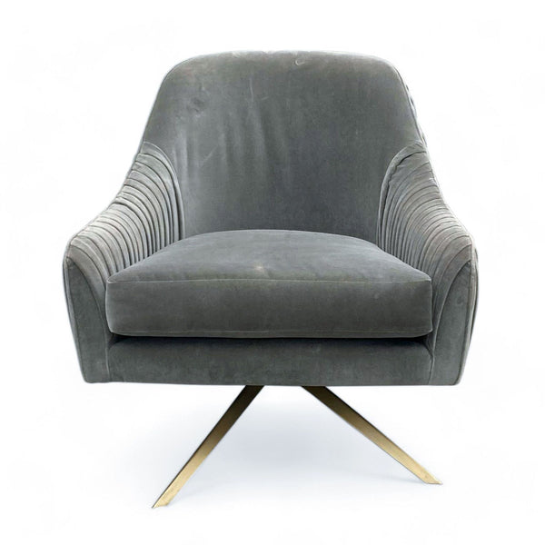 Roar & Rabbit-designed West Elm lounge chair with grey velvet upholstery and pleated backrest on a metal swivel base.