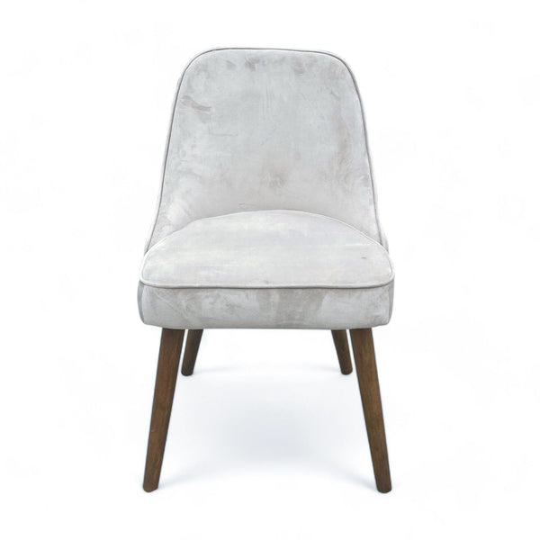 West Elm Mid Century Dining Chair with performance velvet upholstery, wide cushioned seat, and tapered wood legs.