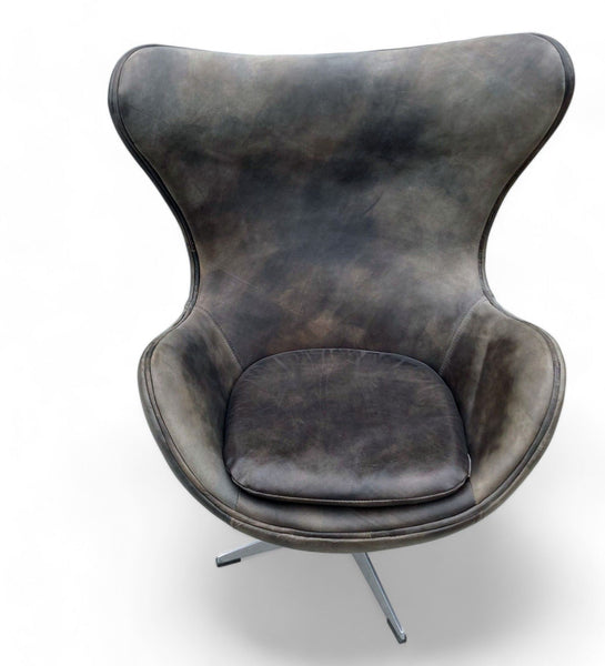 Restoration Hardware Copenhagen swivel lounge chair with curved back and deep seat cushion in leather.
