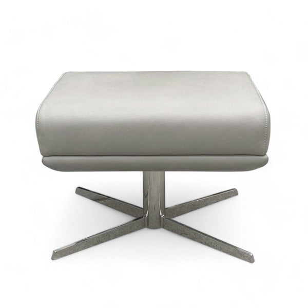 Alt text 1: "West Elm Modern Austin stool with a cushioned gray seat on a distinctive chrome X-base, representative of contemporary furniture."