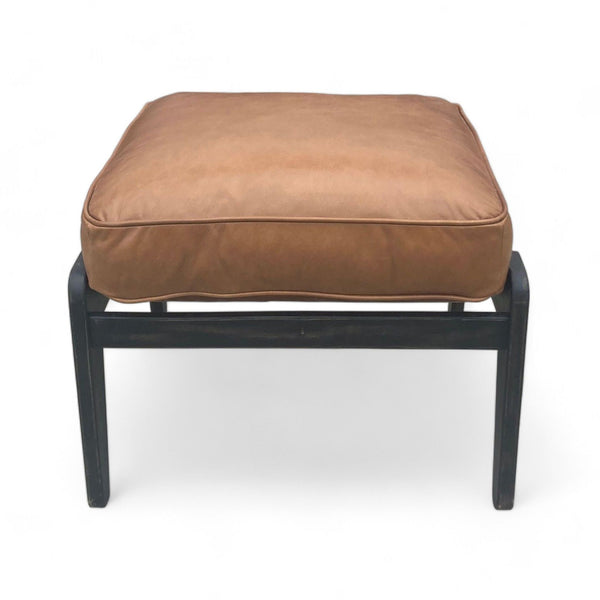 1. "Leather padded ottoman with dark solid wood frame, mid-century design by Pottery Barn."