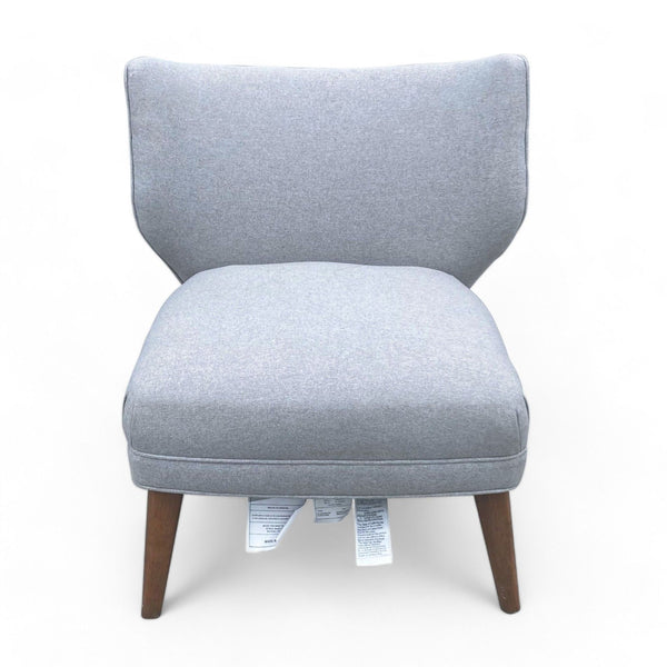 1. West Elm retro accent chair in wingback design with gray chenille tweed upholstery and solid wood legs.