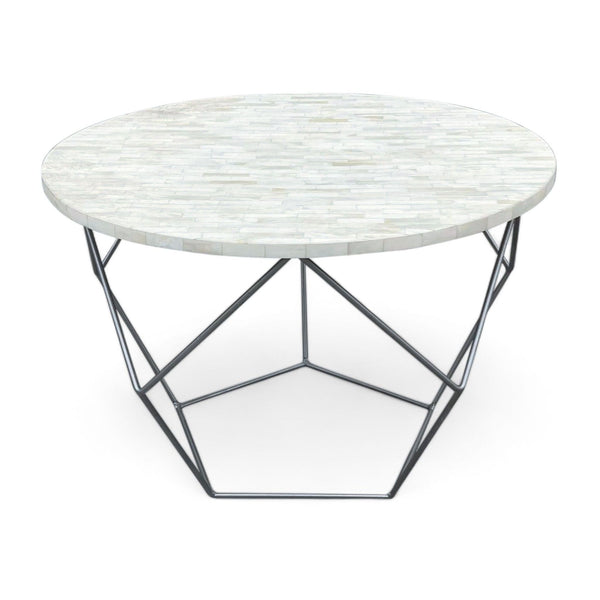 1. "Round West Elm coffee table with hand-inlaid, ethically sourced bone tiles on top and a geometric metal base inspired by paper folding."