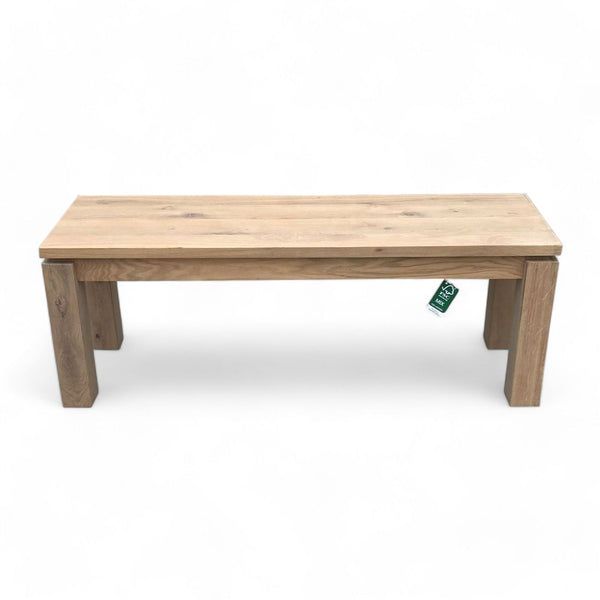1. A wooden Crate and Barrel bench with a natural finish and visible wood grain, branding tag attached to the side.