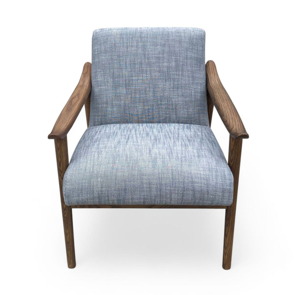 1. West Elm Show chair with elegant wooden arms and textured fabric, offering a contemporary, comfortable design.