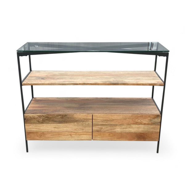 West Elm console table with glass top and black steel frame, featuring mango wood shelf and drawers.