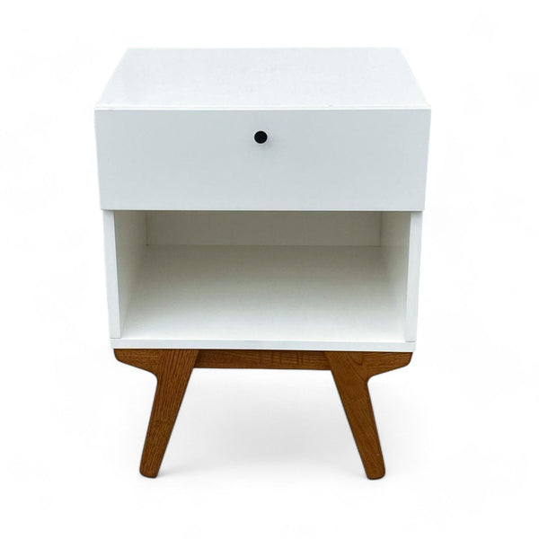 1. Williams Sonoma Mid-Century Modern end table with a white top, drawer, and open shelf on angled wood legs.